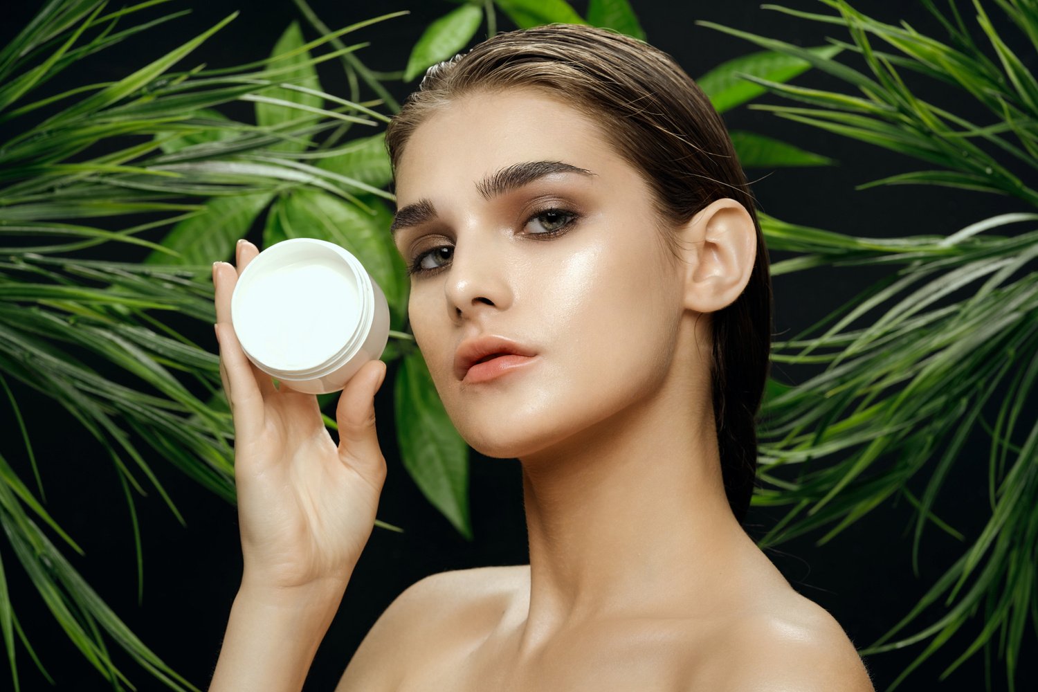 Young Woman Model Holding Skincare Product